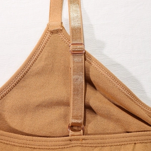 Brown orange seamless sports bra featuring adjustable straps and premium knit texture