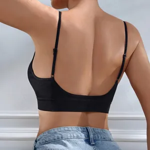Seamless black sports bra with thin adjustable straps and U-shaped back design