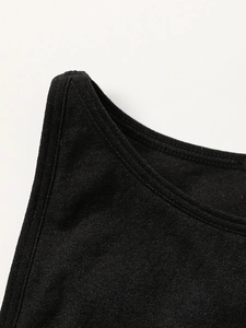 Detailed macro view of black knitted sports bra straps with durable double stitching