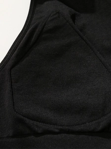 Close-up of the mesh texture and internal padding pocket on a black high-impact sports bra