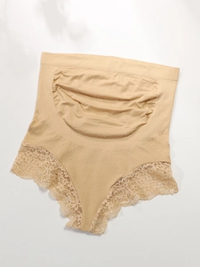 Close-up of high waist maternity briefs featuring lace trim and abdominal pleats