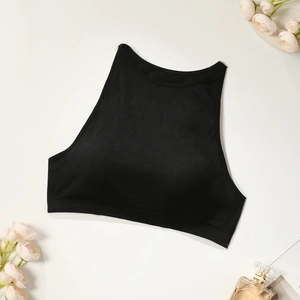 High-neck black sports bra with wide elastic band on a minimal aesthetic background