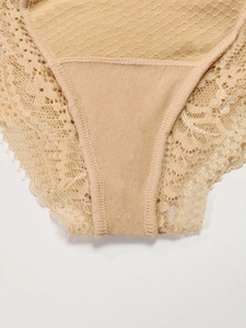 Close-up of high-waist maternity panties featuring intricate lace trim and a breathable crotch