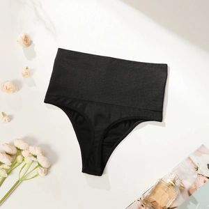 Seamless high waist tummy control thong for women in black ribbed elastic fabric