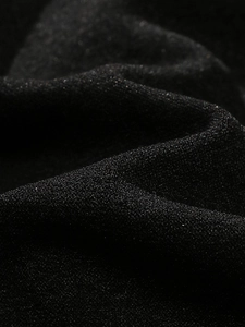 Detailed macro view of black shimmery fabric with metallic glitter for sports bra