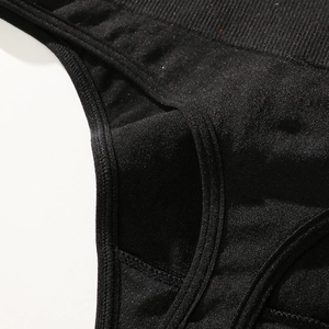 High waist seamless black thong for women featuring ribbed elastic texture and neat stitching