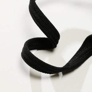 Close-up of black elastic thin straps on a high-impact seamless padded sports bra
