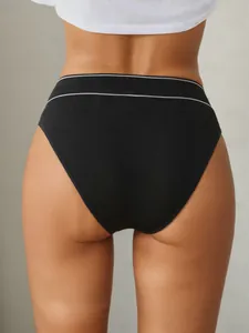 Detail of black seamless sports brief showing white striped waistband and back fit