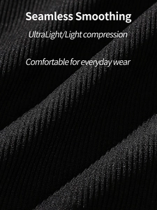 Macro view of black ribbed compression fabric showing seamless texture and high elasticity