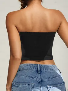 Rear view of black strapless tube top with seamless knit edges and denim jeans
