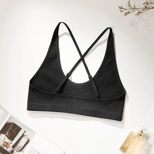 Black ribbed cross-back sports bra with adjustable thin straps and wide hem support