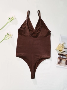 Close-up of chocolate brown ribbed bodysuit with adjustable straps and front twist detail