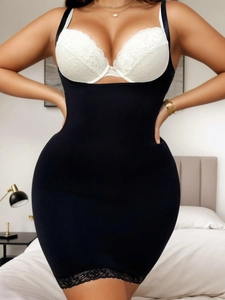 Detailed close-up of slimming bodysuit dress featuring elegant black floral lace trim hemline