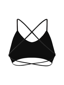 Détail arrière d'un soutien-gorge de sport noir avec fines bretelles croisées en forme de X
