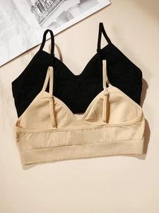 Detail of seamless wireless bras with thin adjustable straps and ribbed fabric texture