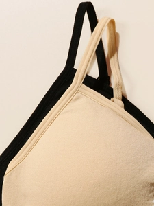 Detail of adjustable thin straps and seamless fabric texture on black and beige camisoles