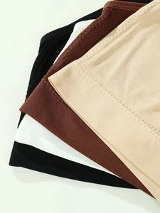 Detail of seamless plus size yoga bras in black, white, brown and nude elastic fabrics