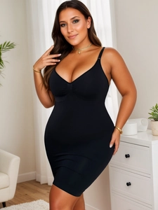 Detail of black seamless shapewear mini dress featuring adjustable straps and V-neckline
