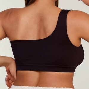 Vista posteriore di un reggiseno sportivo monospalla nero in tessuto a coste elasticizzato