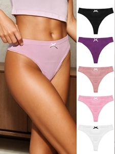 Detail of cotton thongs with lace trim and bow in black, purple, pink and white colors