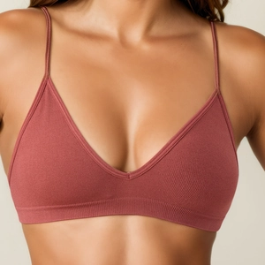 Seamless ribbed yoga bralette with thin straps and V-neck in a brick red finish