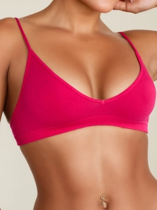 Detailed close-up of rose red seamless yoga bra showing v-neck and ribbed knit texture