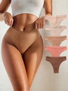 Macro shot of seamless ribbed high waist thongs in assorted earth tones for women