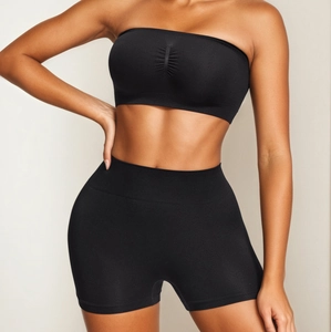 Seamless black sports set with strapless tube top and high waist compression yoga shorts