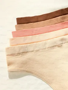 Detail of seamless knitted thongs in multiple colors like brown, coffee, and nude pink