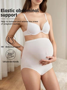 Close-up of white high-waist maternity panties with elastic abdominal support and seamless fit
