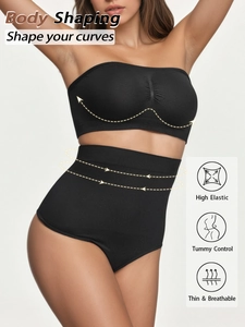 Detail of high elastic black seamless crop top and tummy control shorts with feature icons