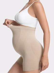 Detailed close-up of high elasticity seamless maternity support panties in nude skin tone