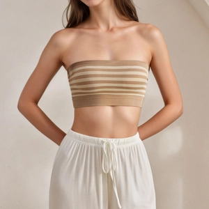 Women's strapless striped tube top in khaki knit paired with white wide-leg trousers