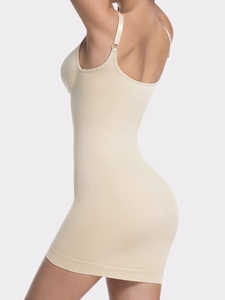 Side view of beige seamless shapewear dress showing adjustable straps and bodycon fit
