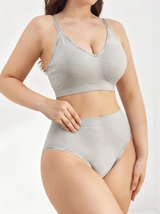 Detail of grey seamless sports bra and panties with LEISURE logo elastic straps