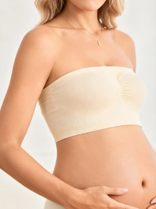 Close-up of seamless beige nursing tube top with center ruching and wide ribbed support band