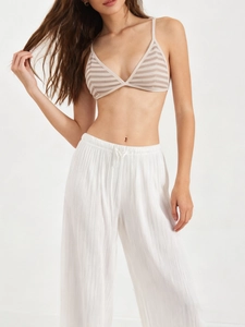 Detailed macro view of thin strap striped bralette with triangle cups and ribbed texture