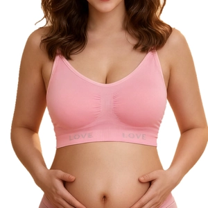 Seamless plus size maternity nursing bra in light pink with wide elastic band and Love text