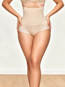 Close-up of high-waisted shaping underwear with delicate lace trim on leg openings