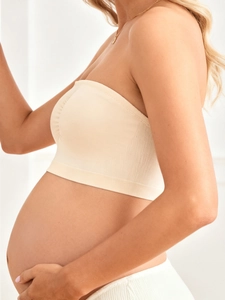 Detail of seamless skin-colored nursing bra with high-elastic knit fabric for comfort