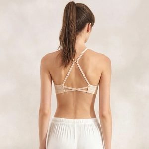 Timeless beige seamless strappy sports bra with adjustable cross back for women