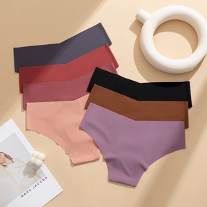 Seamless ice silk panties in six colors arranged fan-style on a warm background