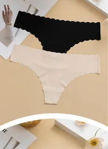 Detail of seamless ice silk thongs in beige and black with scalloped laser-cut edges