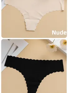 Detail of nude and black seamless thongs with ribbed texture and scalloped edges
