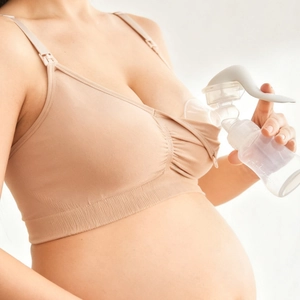 Seamless nursing bra with manual breast pump set for breastfeeding and maternity support