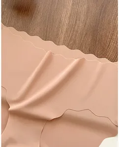 Detail of laser-cut wavy edges on seamless ice silk panties with breathable fabric