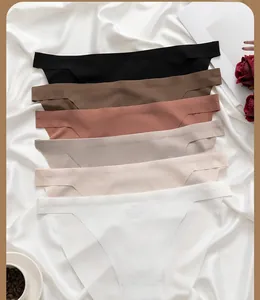 Detail view of seamless high-elastic ice silk panties set in neutral tones on white silk