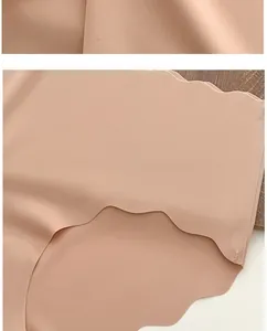 Detail of skin-toned ice silk seamless panties with wavy laser-cut edges and smooth fabric
