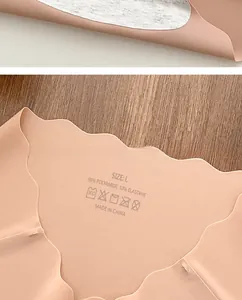 Close-up of nude seamless panties with scalloped edges and breathable cotton lining