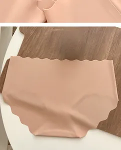 Close-up of pink seamless ice silk underwear with wavy edges and breathable fabric texture